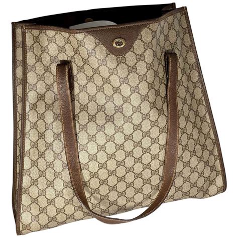 photos of older gucci shoulder bag design|gucci canvas tote bag vintage.